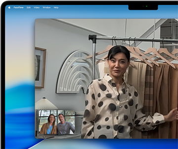 A video call on a MacBook Pro where a woman shows fabrics to two people on the call, with Center Stage keeping her centered in the frame as she moves around